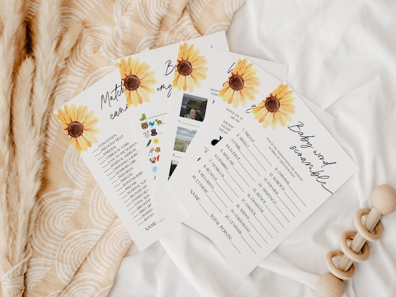 Może przedstawiać: Zestaw trzech kart do gry na baby shower z motywem słonecznika. Gry to "Match the Cans", "Baby Word Scramble" i "When is the Due Date".