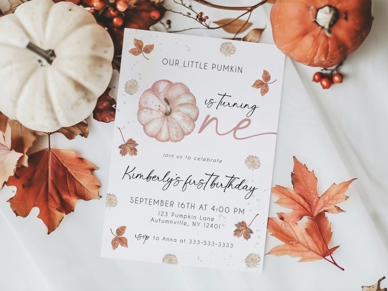 May include: A fall-themed invitation with the text "Our Little Pumkin is turning one." The invitation features a watercolor pumpkin illustration, autumn leaves, and the text "Kimberly's first birthday."
