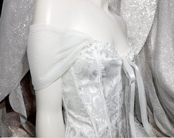 Two removable straps of delicate off-white tulle . The perfect accessory to customize and elevate your bridal ensemble.