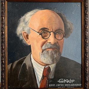 May include: A framed oil painting portrait of a man with a white beard and glasses. The painting is signed "Skrip" and includes the text "KRIP EVGEN MIKHAILOVICH 1918-2016".