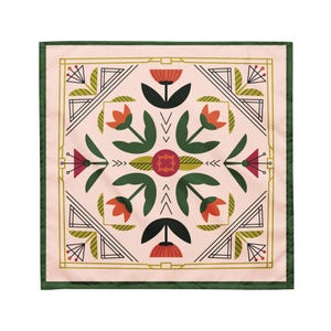 May include: Square scarf with a floral design. The scarf features a light pink background with a symmetrical pattern of orange and red flowers, green leaves, and geometric shapes. The border is green with a gold trim.