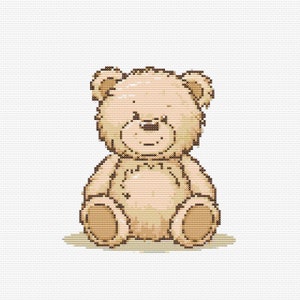 May include: A brown teddy bear with a beige body and brown eyes is sitting on a white background.