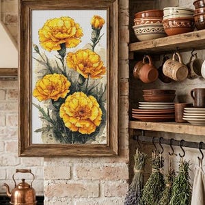 May include: A framed cross-stitch embroidery featuring four vibrant yellow marigold flowers with green stems and leaves, displayed in a dark wooden frame. The artwork depicts detailed floral textures against a light, neutral background.