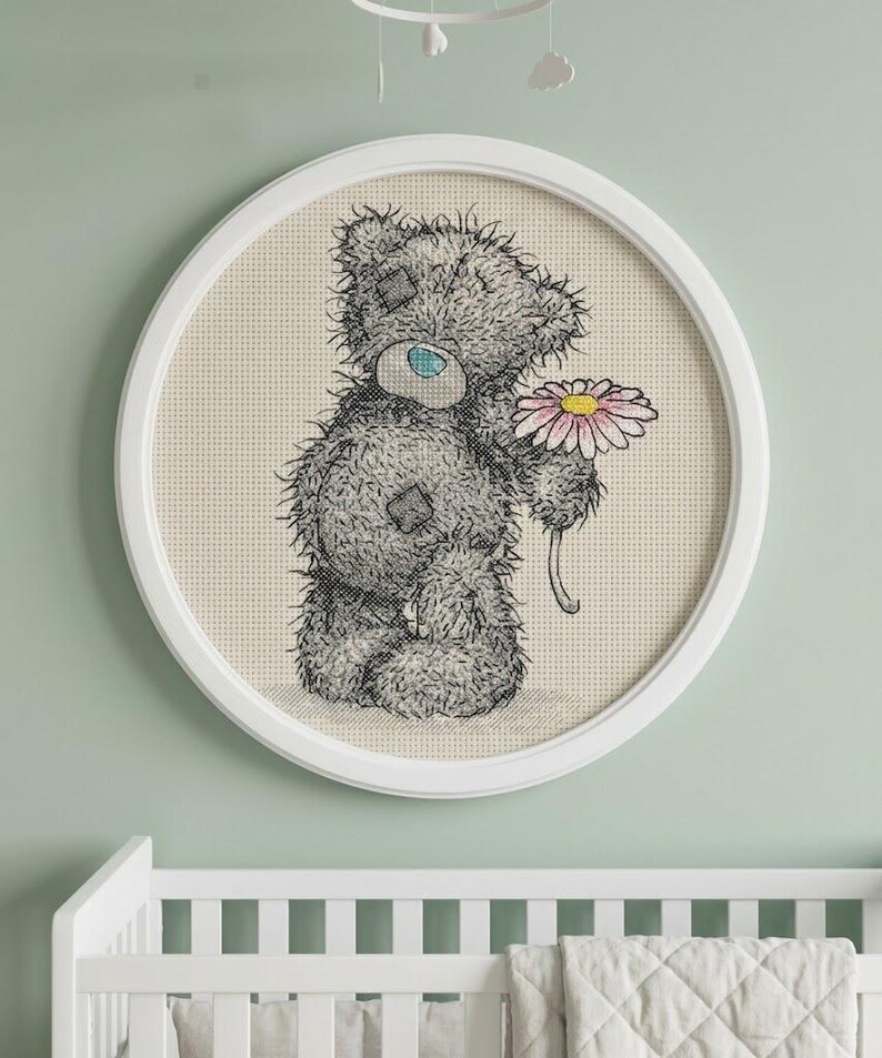 Cute teddy bear cross stitch pattern pdf compatible with pattern keeper sweet grey plushie holding daisy flower counted needlepoint chart instant digital download lovely nursery embroidery design diy handmade craft canvas project kids room wall decor baby shower gift idea whimsical animal portrait floral bloom motif charming slow living needlework hoop display playroom accent detailed heirloom stitched picture gift mom artisan aesthetic soft toy motif for 14 count white aida cloth needlecraft