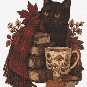 May include: A cross-stitch pattern featuring a black cat sitting behind a stack of books, draped in a red and black plaid scarf. A cream-colored mug with a brown mushroom design sits in front, surrounded by autumn maple leaves and oak sprigs.
