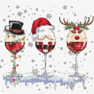 May include: Three wine glasses filled with red liquid, each decorated for Christmas. One is a snowman with a top hat, another is Santa Claus, and the third is a reindeer. Snowflakes fall in the background, creating a festive holiday scene.
