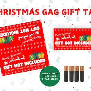 May include: Red and white Christmas gift tag with the text "Gift Not Included" and a cartoon image of Santa Claus and reindeer. The tag also includes the text "Merry Christmas!" and "All the power you need for that gift you really want!"