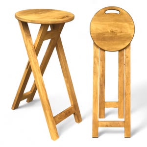 May include: Two wooden folding stools with a round seat and a simple design. The stools are made of natural wood and have a light brown finish.
