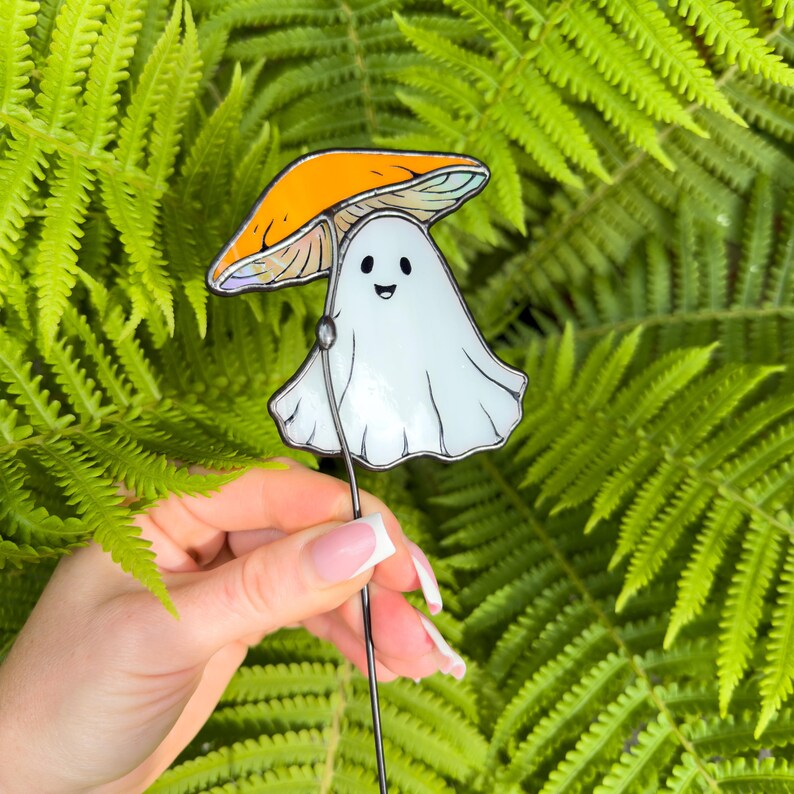 Stained glass ghost under orange mushroom plant stake. Christmas gift for mom. Cute ghost decor, handmade mushroom gift, whimsical garden decor