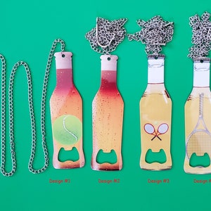 May include: Four different designs of bottle opener keychains. Each keychain features a silver chain and a bottle opener shaped like a beer bottle. The bottle opener designs include a tennis ball, two tennis rackets, and a tennis racket with a tennis ball. The keychains are displayed against a green background.