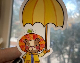Funny Vinyl sticker, Grumpy Lion in raincoat with umbrella. Vinyl-perfect for water bottles, laptops and sketchbooks