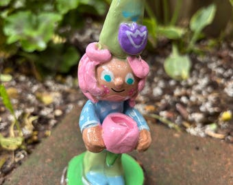 Little  garden gnome figure  with her favorite tulip flower to brighten your desk, indoor plants, garden or patio. One of a kind!