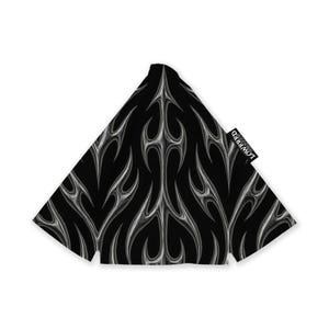 May include: Black and silver patterned fabric with a flame-like design. The fabric is shaped like a triangle. The word "LOWRED" is printed on a small white tag attached to the fabric.