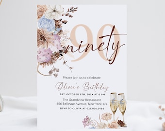 May include: A 90th birthday invitation card featuring watercolor floral arrangements in shades of blue, purple, and beige. The text reads 90 ninety, Please join us to celebrate Olivia's Birthday, SAT. OCTOBER 8TH, 202X AT 6 PM, The Grandview Restaurant, 456 Bellevue Avenue, New York, NY, RSVP TO OLIVIA AT 021.000.0456, with two champagne flutes.