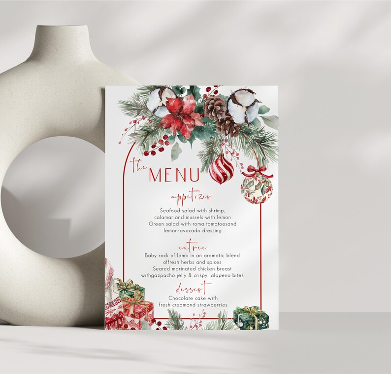 May include: A rectangular menu card featuring a red arched border and watercolor illustrations of pine branches, red poinsettias, cotton bolls, pinecones, red berries, and Christmas ornaments. The text lists appetizers, entrees, and desserts.