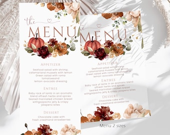 以下が含まれることがあります： THE MENUというセリフ体の文字が書かれた白いメニューカード。オレンジ色のカボチャ、濃い赤とベージュの花、緑の葉の水彩画が描かれています。メニューには前菜、メインディッシュ、デザートが記載されています。