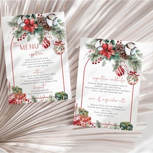 May include: Two rectangular menu cards featuring a Christmas theme with watercolor illustrations of poinsettias, pine branches, pinecones, red and white ornaments, and gift boxes. The text includes "the MENU", "appetizer", "entree", "dessert", "signature cocktails", and "wine & refreshments".