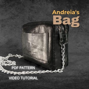 May include: Black leather bag with a silver chain strap. The bag is square with a front pocket and a zip closure. Text on the image reads "Andreia's Bag", "PDF Pattern", and "Video Tutorial".