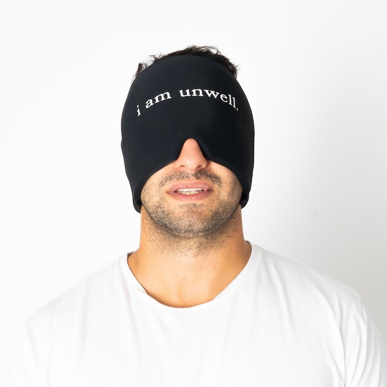 man wearing "i am unwell" hangover hugg