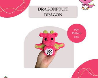 May include: A crochet pattern for a dragonfruit dragon amigurumi. The pattern is available as a PDF download. The image shows a pink dragonfruit dragon with green wings, holding a white and black dragonfruit.