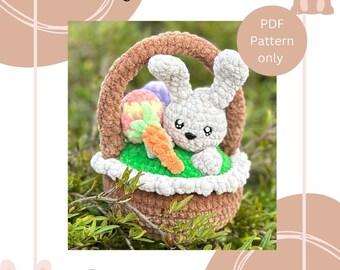 May include: A crocheted bunny rabbit sitting in a brown crocheted basket with a green and white crocheted lining. The bunny is holding a carrot and a colorful Easter egg. The text "Bunny in a basket" is at the top of the image. The text "PDF Pattern only" is in the upper right corner of the image. The text "@mrscrochetdesigns" is in the lower right corner of the image.
