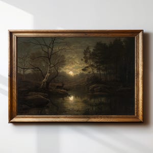 May include: A framed painting depicting a moonlit forest scene with a lake in the foreground. The trees are silhouetted against the night sky, and the moon is reflected in the water. The painting is in a dark, muted color palette.