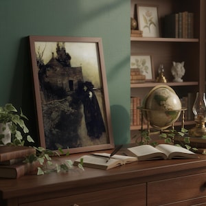 May include: A framed print of a dark, moody landscape with a figure in a long coat. The print is displayed on a wooden desk with books, a globe, and a small lamp. A bookshelf filled with books and decorative items is in the background.
