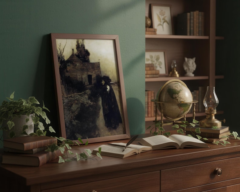 May include: A framed print of a dark, moody landscape with a figure in a long coat. The print is displayed on a wooden desk with books, a globe, and a small lamp. A bookshelf filled with books and decorative items is in the background.