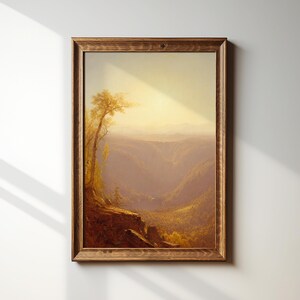 May include: A framed painting depicting a landscape scene with a single tree in the foreground and a valley in the background. The painting is done in warm, muted tones of brown, yellow, and orange.