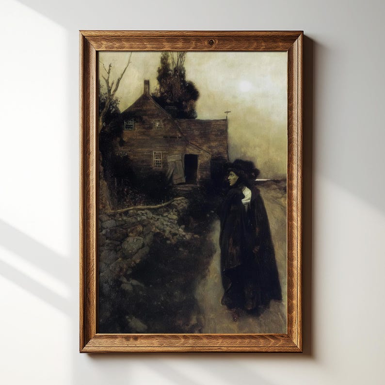 May include: A framed print of a dark, moody painting. The artwork depicts a figure in a long black coat walking on a path near a weathered wooden house. The scene is set under a dim, overcast sky, evoking a sense of mystery.