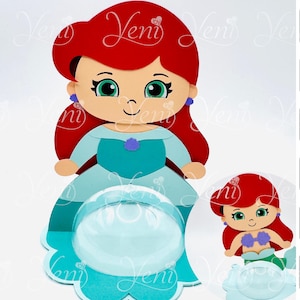 May include: A red-haired mermaid character with a blue dress and a clear plastic dome. The character is holding a purple seashell. The image includes text: "Instant download", "Descarga directa", "Step by Step", "Paso a Paso", "For Silhouette", "Para Silhouette", "Spoon Opening", "Apertura Spoon", "8cm - 3.15"