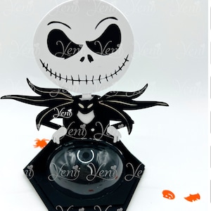 May include: A black and white Jack Skellington character from the Nightmare Before Christmas movie is featured on a black and white 3D pop-up card. The card is designed to be used with a Silhouette cutting machine. The card is 8cm (3.15 inches) in diameter.