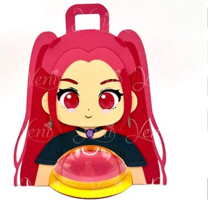 May include: A layered papercraft design featuring a cartoon girl with red hair and large red eyes. The girl is wearing a black top and a purple pendant. The design includes a handle at the top and a decorative base. The image also includes icons for digital downloads.