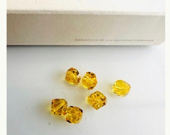 6pcs Original Swarovski® Light Topaz 6mm Graphic Cubic Bead 6pcs Original Swarovski® Light Topaz 6mm Graphic Cubic Bead