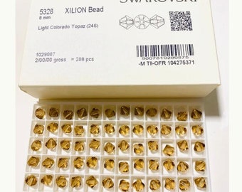 10 pièces Swarovski® Light Colorado Topaz 5328 XILION de perles toupies - Entièrement percée - Taille 8 mm