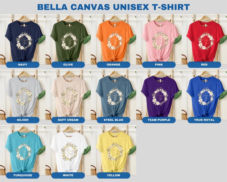 May include: A Bella Canvas unisex t-shirt featuring a floral wreath with the text "Thank You" in gold lettering. The shirt is available in 12 colours: navy, olive, orange, pink, red, silver, soft cream, steel blue, team purple, true royal, turquoise, white, and yellow.