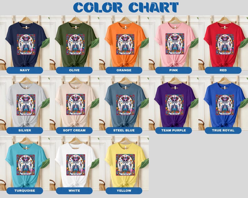 May include: Colour chart displaying various t-shirt colours featuring a colourful skull graphic and the text "Dia de los Muertos". The colours include navy, olive, orange, pink, red, silver, soft cream, steel blue, team purple, true royal, turquoise, white, and yellow.