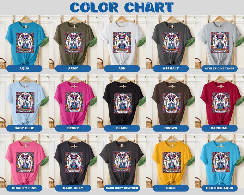 May include: Colour chart displaying 15 different t-shirt colours with a graphic of a sugar skull with flowers on each shirt. The colours are: aqua, army, ash, asphalt, athletic heather, baby blue, berry, black, brown, cardinal, charity pink, dark grey, dark grey heather, gold, and heather aqua.