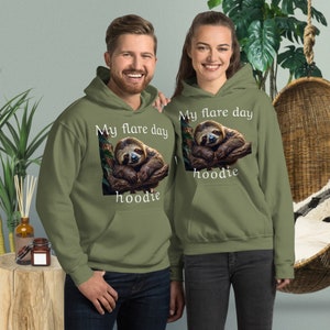 May include: Two green hoodies with a sloth graphic and the text "My flare day hoodie".