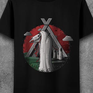 May include: A black t-shirt with a graphic design of a white hooded figure with a skull-like face standing in front of a wooden structure. The figure is surrounded by a red and green circle with clouds and vines.