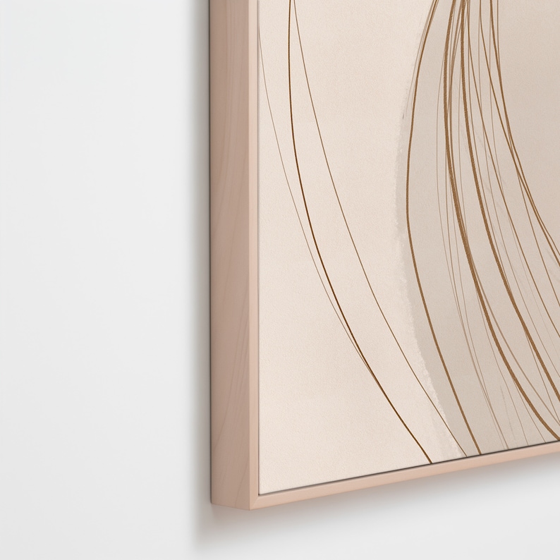 May include: Abstract art print featuring a beige background with flowing brown lines and shapes. The artwork is framed in a light wood frame, creating a modern and minimalist aesthetic. The artwork is suitable for home decor.