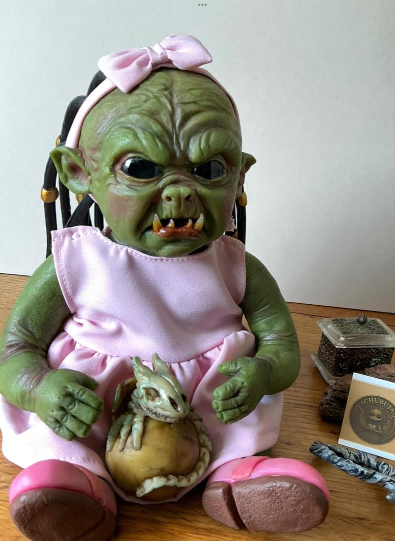 Handmade Goblin Baby Doll – Creepy Cute Monster Doll in Pink Dress – Fantasy Art Doll with Copper Coin – Unique Collectible