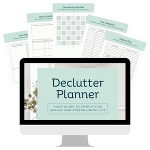 May include: A computer monitor displays a "Declutter Planner" with the text "Your Guide to Simplifying Spaces and Streamlining Life." Several teal-colored planning sheets are arranged around the monitor, including a decluttering schedule and task categories.