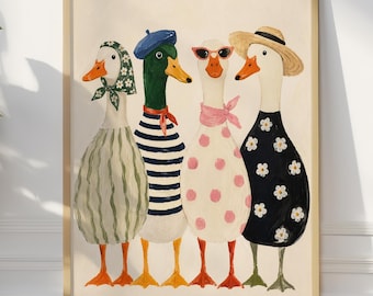 May include: A framed art print featuring four anthropomorphic ducks. Each duck is dressed in unique attire, including dresses, hats, and scarves. The ducks have orange beaks and feet, with a neutral background. The artwork is displayed against a white wall and a wooden floor.