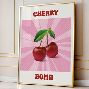 Puede incluir: Un póster rosa y blanco con un gráfico de cereza roja y el texto "CHERRY BOMB" en rojo.
