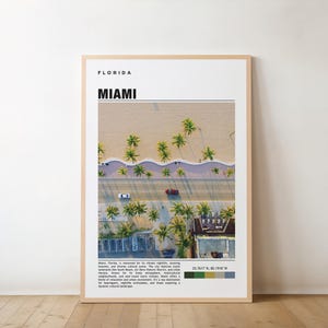 May include: A poster with a minimalist design featuring an aerial view of palm trees lining a beach in Miami, Florida. The poster includes the text "FLORIDA" and "MIAMI" in bold black font. The poster also includes a color palette with shades of green, yellow, blue, and gray.