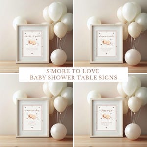 May include: Four printable signs for a baby shower with a s'mores theme. The signs are in white frames with a pink and brown background. The signs say "Cards & Gifts", "Diaper Raffle", "S'mores Bar", and "Favors".