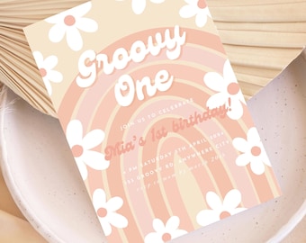 May include: A pastel pink and yellow birthday invitation with a rainbow and daisies. The text reads "Groovy One" and "Mia's 1st birthday!"