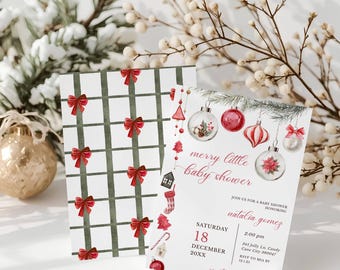May include: Two Christmas-themed baby shower invitations. One features a green grid pattern with red bows. The other has holiday ornaments and the text "merry little baby shower" with event details. Decorative sprigs and a gold ornament are in the background.