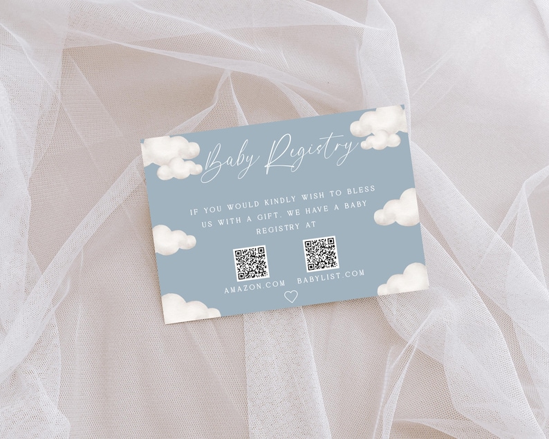 May include: A blue and white baby registry card with clouds and the text "Baby Registry". The card includes QR codes for Amazon and Babylist.